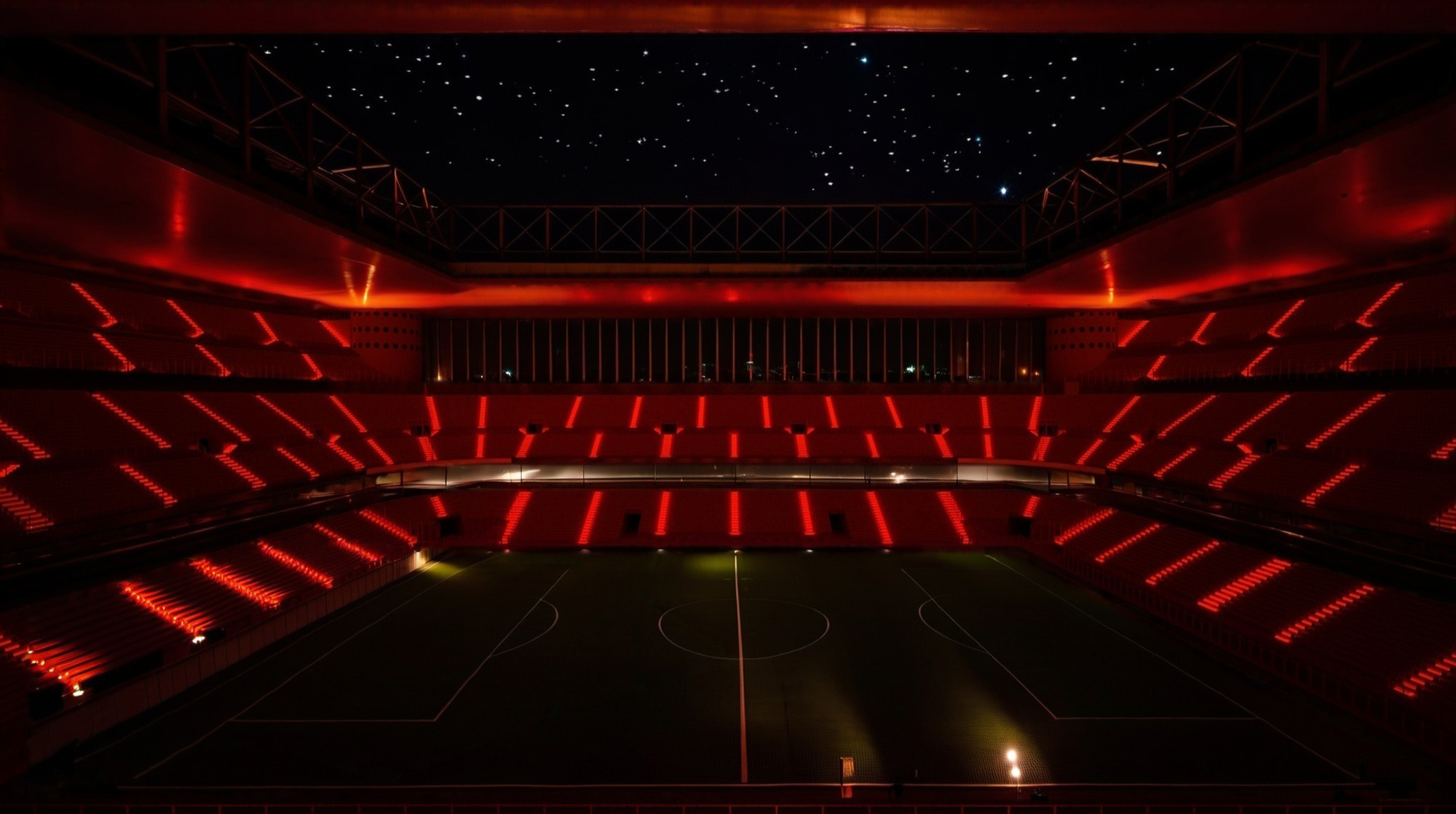 Stadio di San Siro con scenografia notturna con luci rosse - Arco Associati